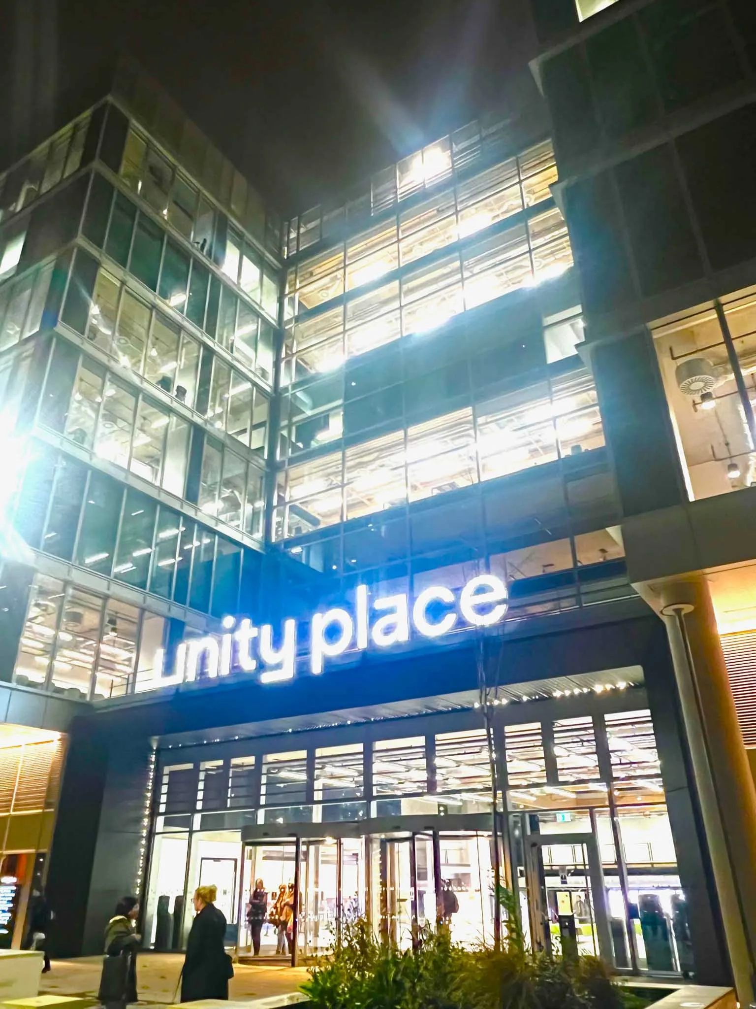 A large building with a sign that says Unity Place.